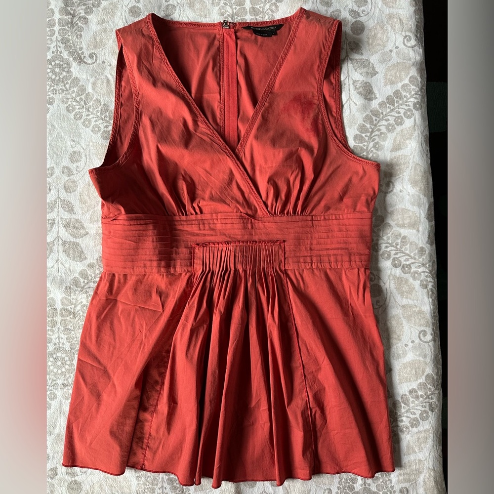 Sleeveless front pleated blouse